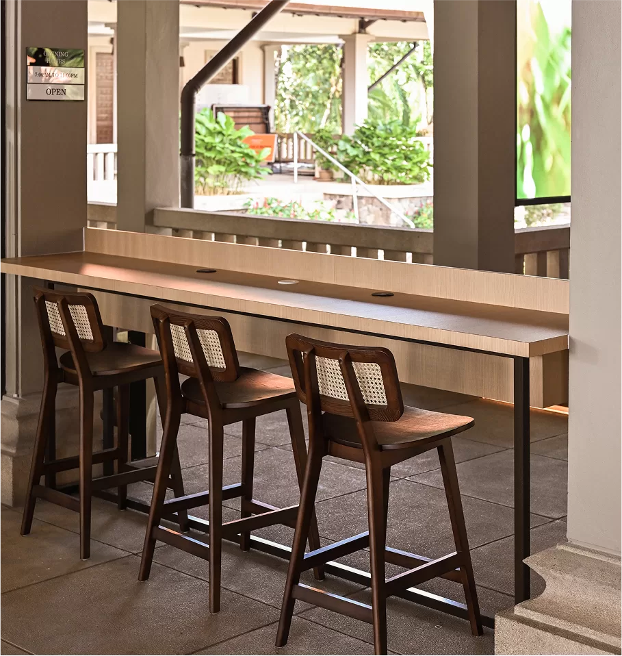Wooden bar stools featuring rattan caning Wooden bar stools featuring rattan caning, designed to complement modern hospitality interior design
